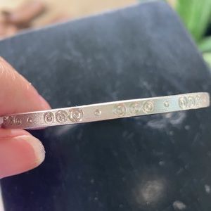 5/$25 Very small or Child’s silver tone bangle.